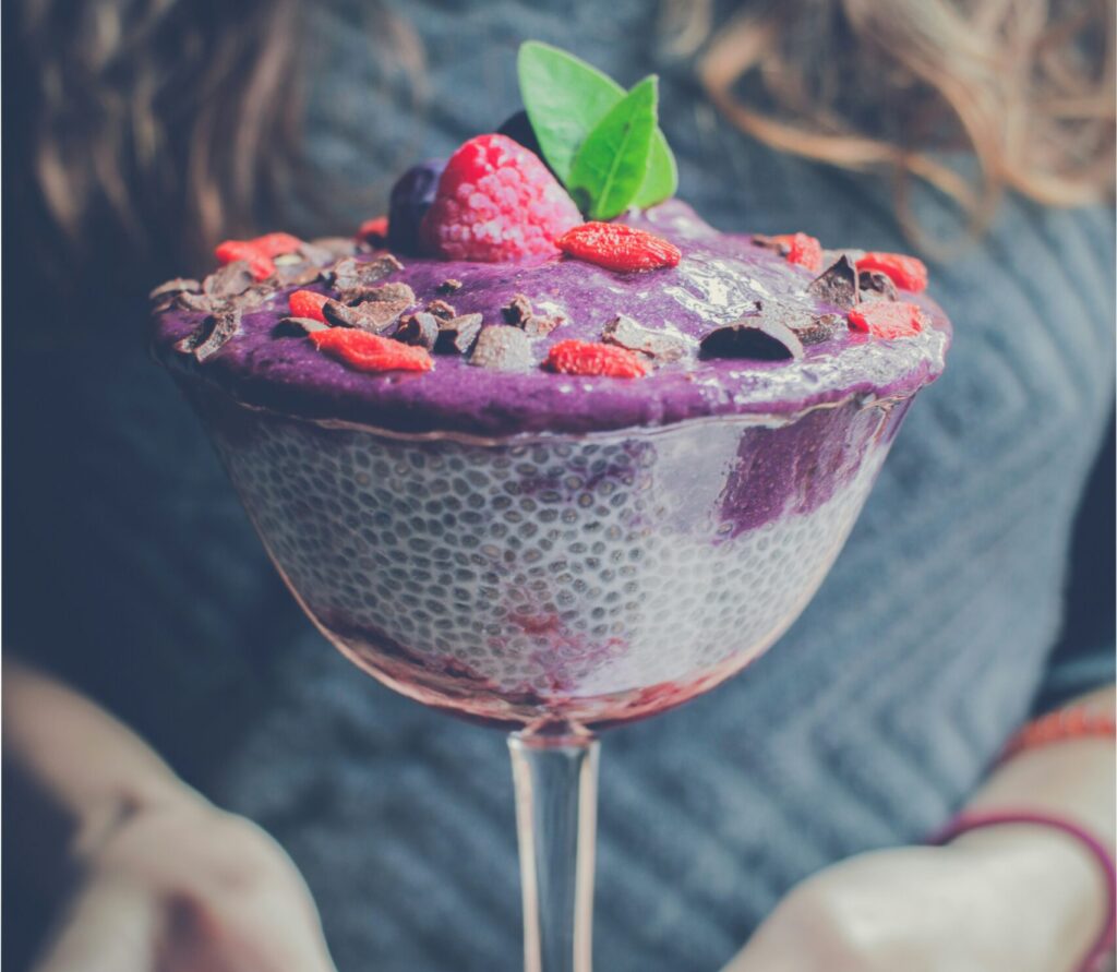 shaved ice with strawberry and blueberry toppings